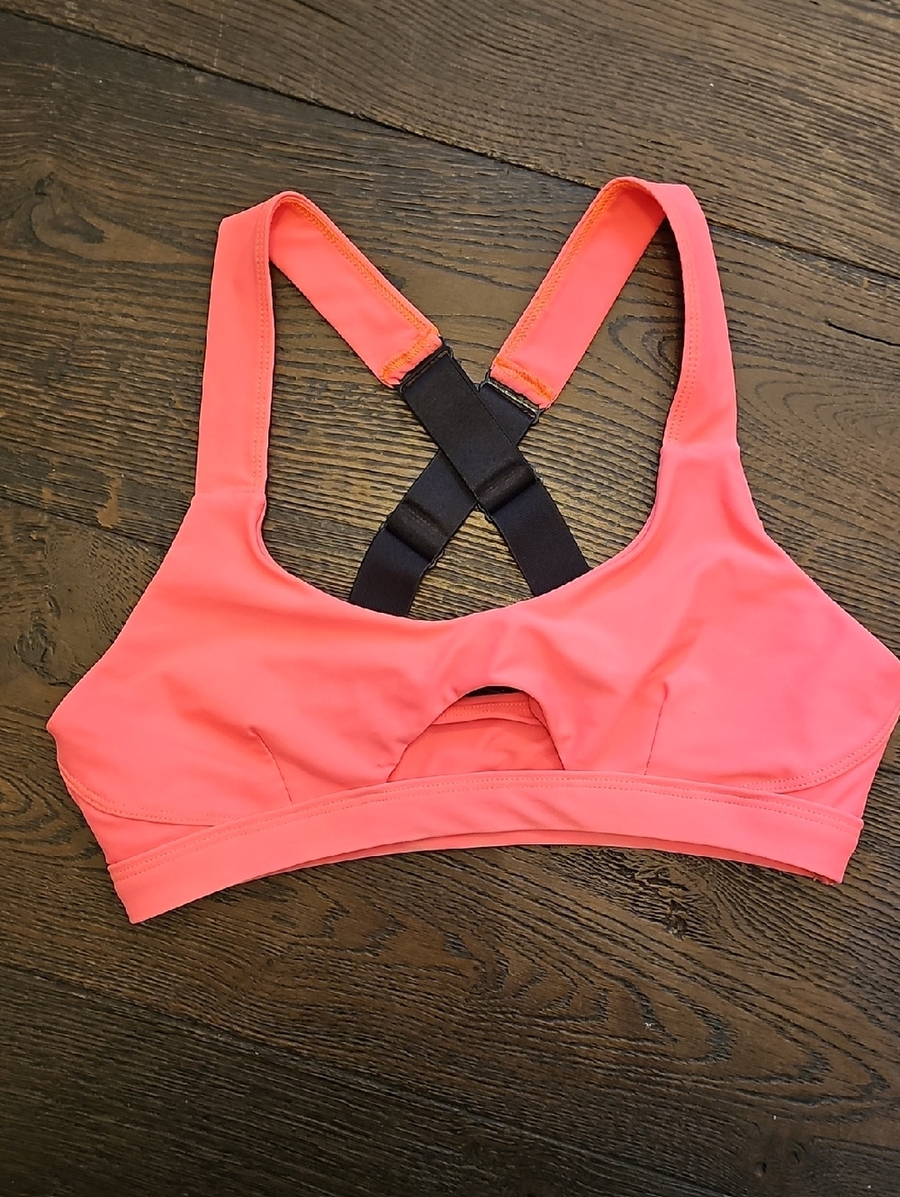 Bombshell Sportswear Neon Coral Glow Sports Bra with Black Crisscross Straps